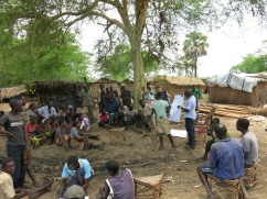 Ishmael and Marije discuss the state of the marsh with residents of a fishing villages